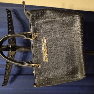 Black Bebe tote bag with gold hardware and chain